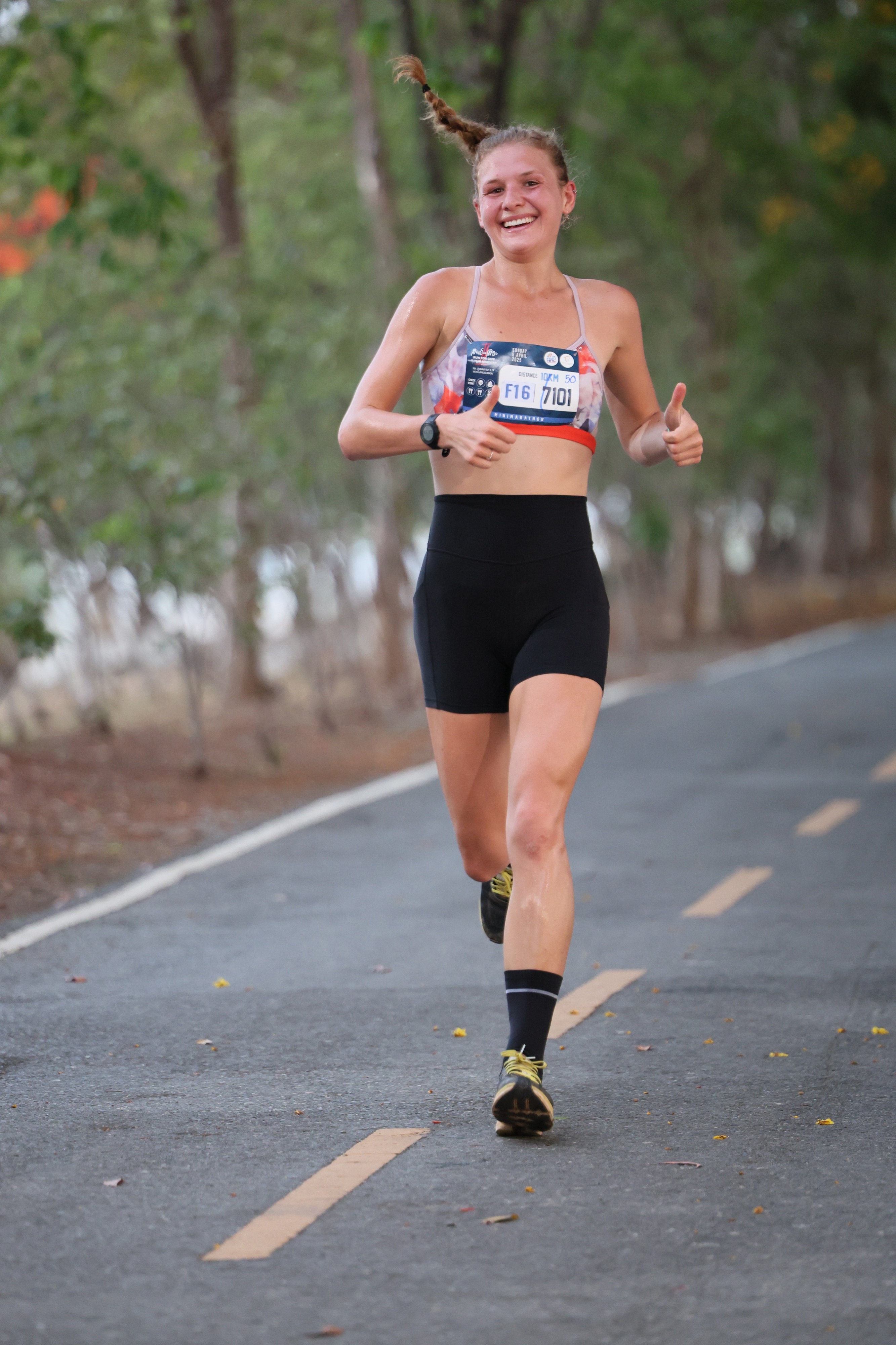 Kiana giving a thumbs up during a race